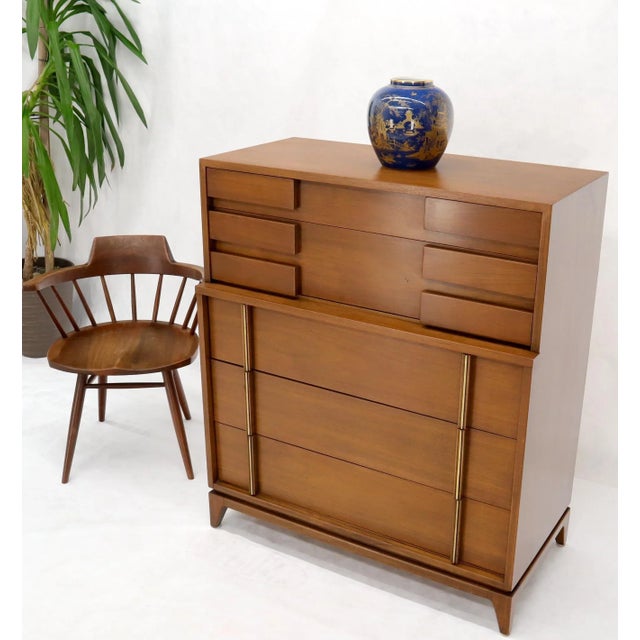 American of Martinsville Mid-Century Modern walnut high chest dresser with block front drawers and brass accents.