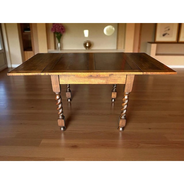 Proffessionally restored barley twist draw leaf table. Table is sturdy and strong with hand turned barely twist legs....