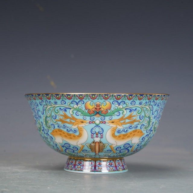 This exquisite set of six porcelain bowls comes presented in a custom-fitted wooden box with a pierced decorative lid....