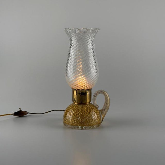 Elegant and highly refined table lamp designed by Archimede Seguso for Seguso Vetri d’Arte in the 1940s, an exquisite...
