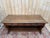 A solid walnut neo-renaissance style console table, made in lyon between 1890 and 1910. the symmetrical structure features...