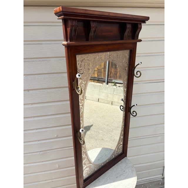 Pulaski Mahogany Hall Tree with Decorative Frosted Glass Mirror and Marble Top. Great condition. Minimal household wear....