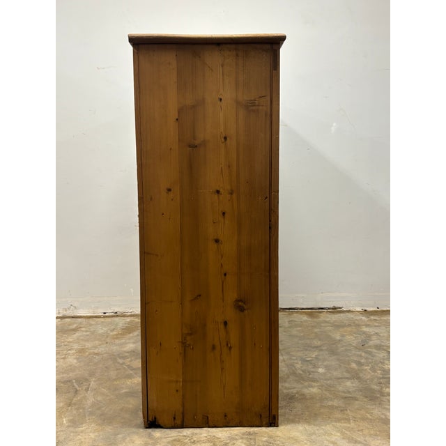 This 19th century English pine cupboard carries the quiet charm and character only time can bestow. Its lovely paneled...
