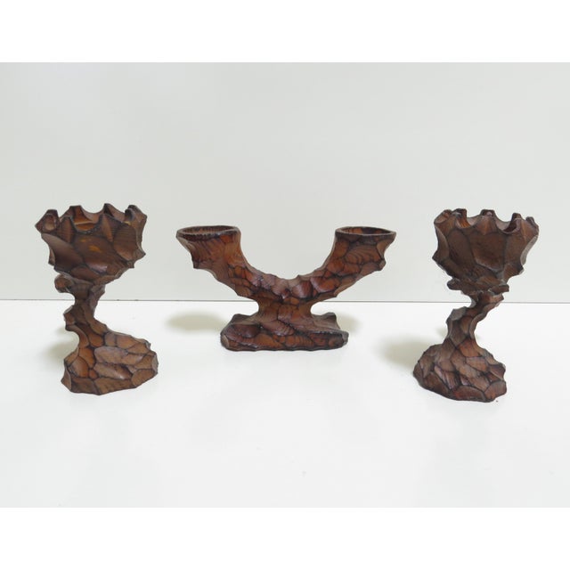 Vintage German 3-piece set, hand carved wooden candle holder.s In the Brutalist style, with organic lines, and a hammered...