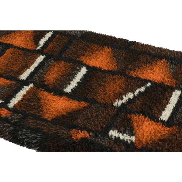 Hand-knotted in lush, high-pile wool in Sweden circa 1960-1970, this 3x5 vintage Swedish Rya rug is a bold new addition to...