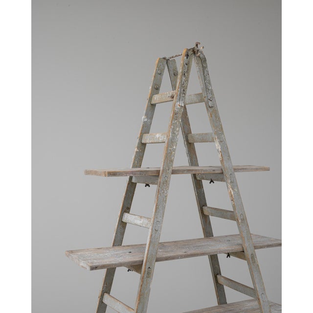 This 20th Century French A-frame ladder shelf embodies rustic utility with timeless French character. Crafted from aged...