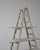 This 20th Century French A-frame ladder shelf embodies rustic utility with timeless French character. Crafted from aged...