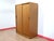 A beautiful British armoire with sliding doors, this Mid Century Modern Vintage Teak Sliding Door Armoire Wardrobe in the...