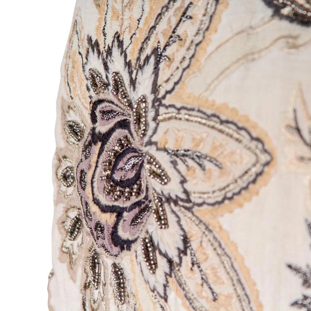 Pair of decorative pillows featuring sequin embroidered flower motifs. Dimensions: 18”L x 10”W x 3”H