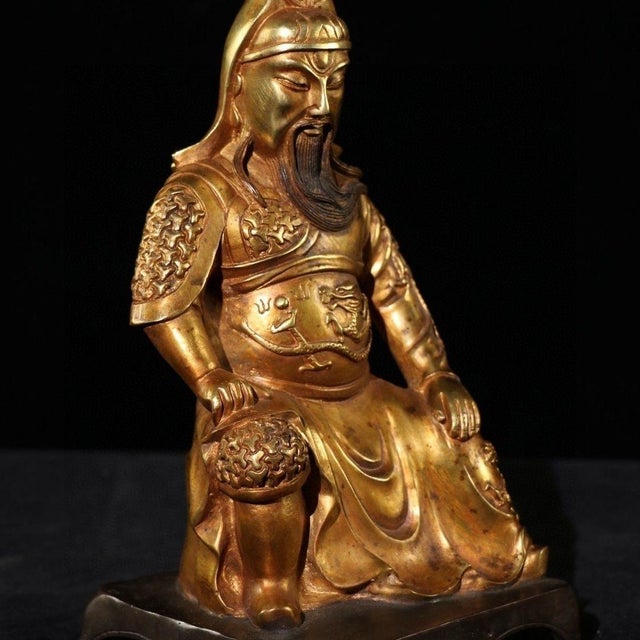 This seated Guan Gong statue is solid cast brass with gilded surface. Guan Gong is revered in Chinese culture as the God...