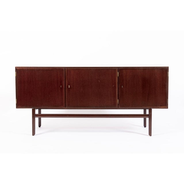 This iconic vintage mid century credenza modern credenza or sideboard cabinet designed by Ole Wanscher and produced by...