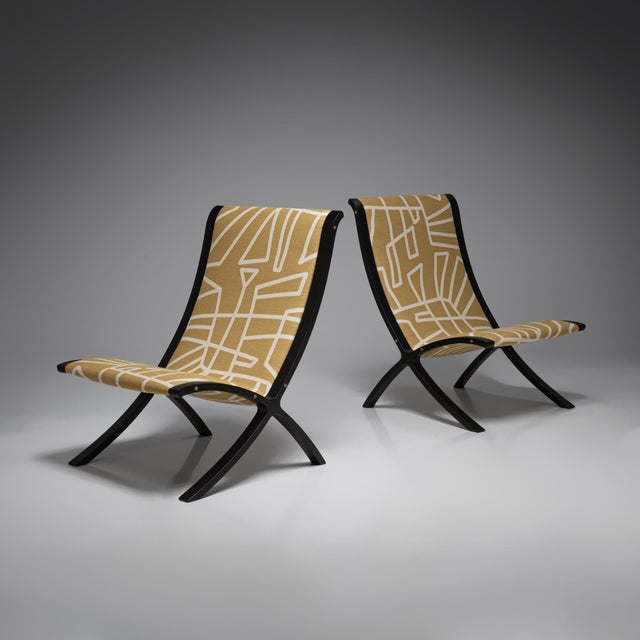 The AX Easy Chair is a celebrated example of Danish mid-century design by architects Peter Hvidt and Orla Mølgaard-...