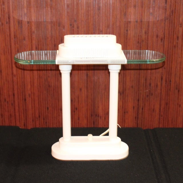 This Vintage White 1980s Halogen Desk Lamp has the clean, modernist design championed by Robert Sonneman and George...