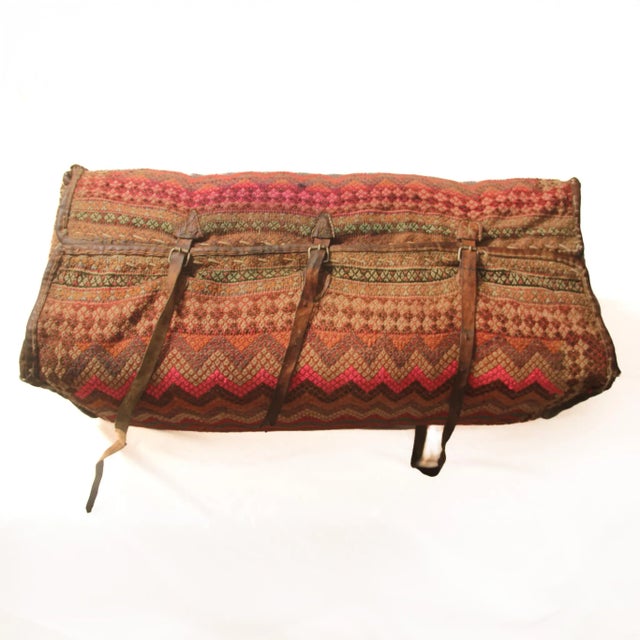 Add a touch of global charm and history to your home with this stunning vintage Middle Eastern camel bag. Handwoven with...