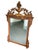 Louis XVI French style floral urn mirror. Antique gold leaf with red and very light hues of green patina. A beautiful...