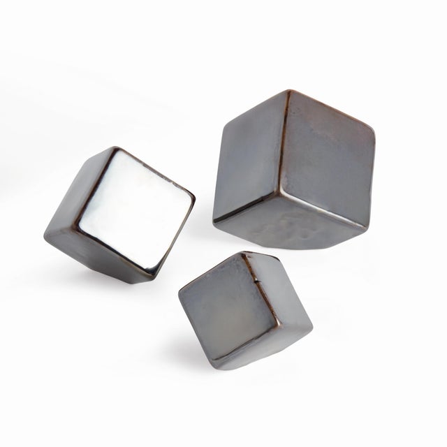 What is better than a simple three dimensional stoneware rendition of a square? A set of three. These cubist sculptures in...