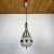 Superb mid-century chandelier made in Italy in the 1960s. Thick glass decorated with an ornament is framed by a metal...