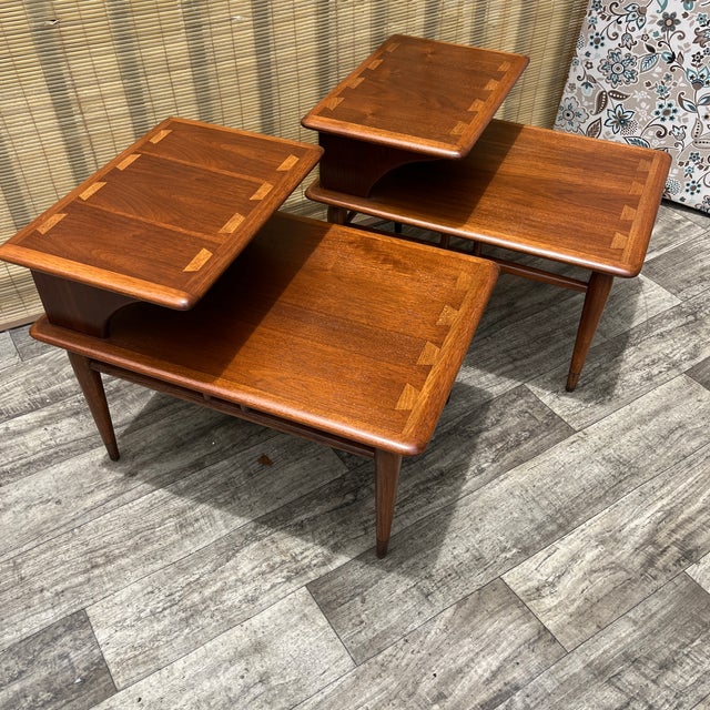 A Pair of Vintage Newly Refinished Mid Century Modern Two Tiered Side Tables By Lane Acclaim Circa 1960s . Features a...