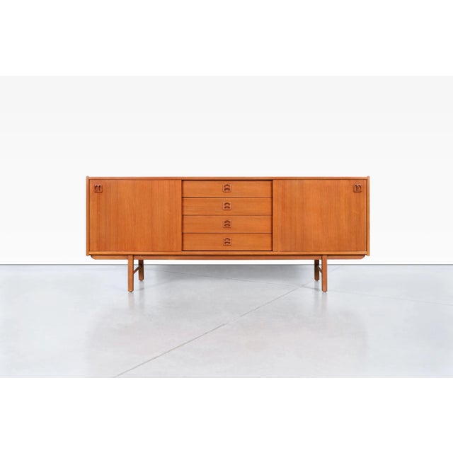 Designed by Erik Wortz for IKEA’s sought-after Korsor collection, this exceptional Danish modern teak credenza captures...