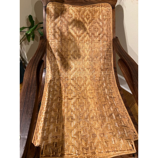 Antique early 20th century, Indian rosewood plantation chair. Very well preserved for it's age. Extendable arms attached...