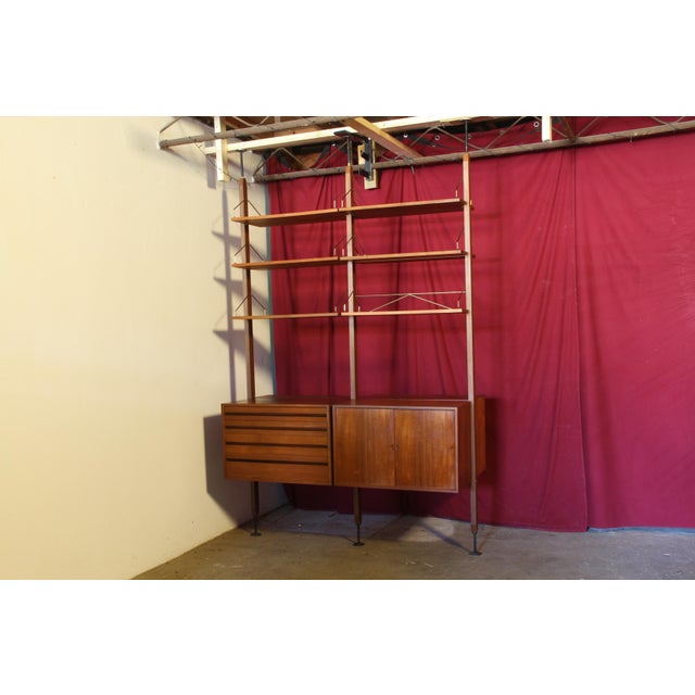 A rare opportunity to acquire an original free-standing room divider with 7 solid teak poles (only 6 photographed) from...