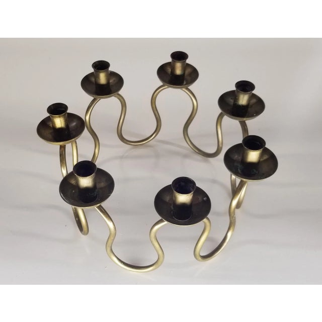 Vintage 1950's brass candlestick by Lars Holmström for Arvika. Mid-century modern wave design with 7 candle holders.