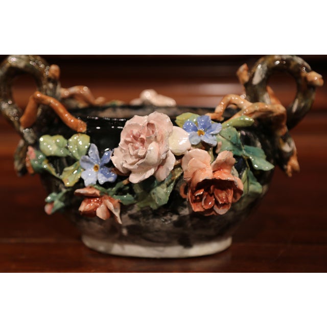 This elegant colorful hand painted Majolica planter was sculpted in Montigny sur Loing, France, circa 1860. The ceramic...