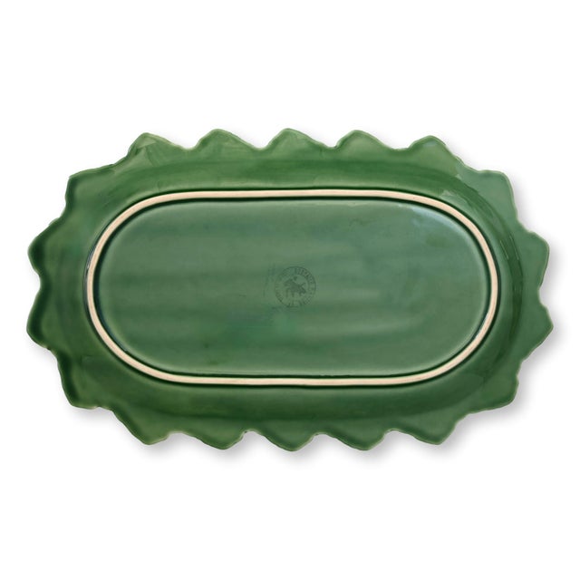 A vintage Bordallo Pinheiro majolica sandwich tray featuring paired bunny medallions, scrolling vines, and a sculptural...