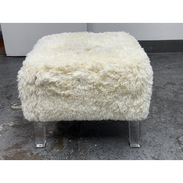Design Plus Gallery presents a Faux Fur Ottoman by Skyline Furniture. Upholstered in plush ivory faux fur, this...