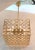 A truly unique and beautiful Italian 1970s gold on brass chandelier in a cube shape with crystal disk accents and...