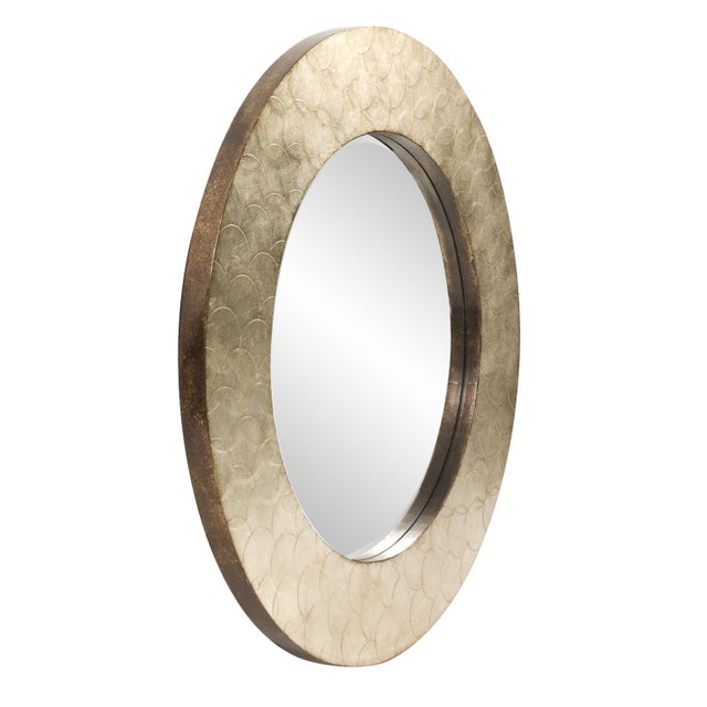 Our Camelot Mirror is an interesting piece featuring a round wood frame characterized by a scaled textured metal overlay....