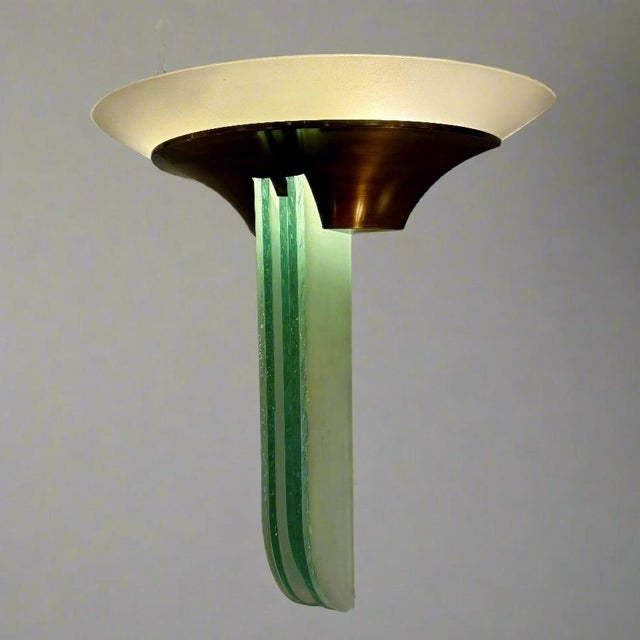 An important pair of French Art Deco large Jean Perzel sconces from France circa 1930. These unique sconces feature...