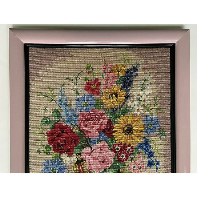 Beautiful floral professionally framed needlepoint with stitched signature made in 1987. Color of outer edge of frame...