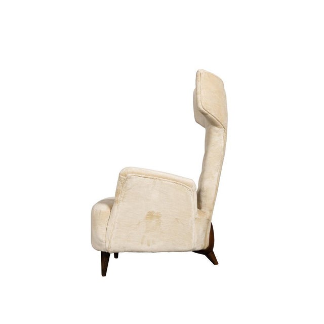 Beautiful and rare modern armchairs designed by the great Renzo Zavanella, in excellent condition, recently reupholstered....