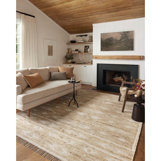 The Rivers Collection by Angela Rose x Loloi is a modern flatweave area rug with a reversible design featuring symmetrical...