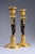 Pair of Directoire period candlesticks with Nubian figures, early 19th century. Gilt and patinated bronze candlesticks,...