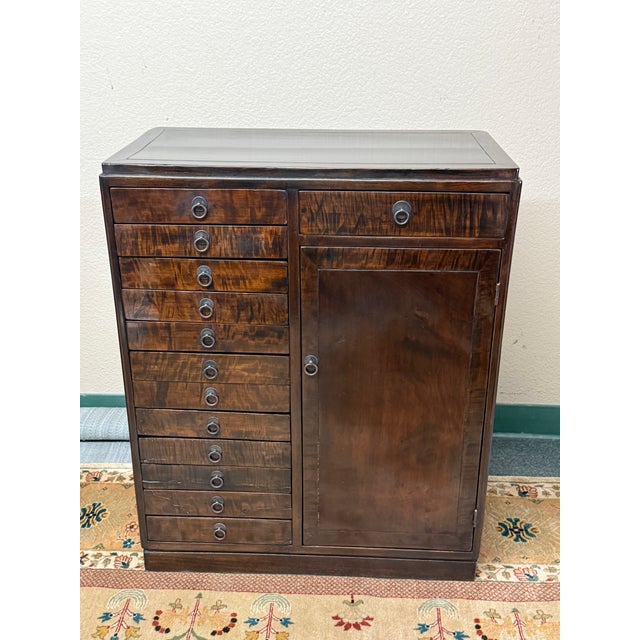 Design Plus Gallery presents a Collector's Cabinet from the 19th Century or in that Style. The chest has thirteen exposed...
