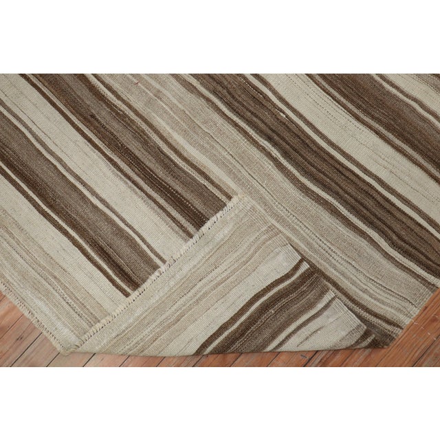 20th-century neutral color kilim with a striped design Measures: 5' x 5'10".