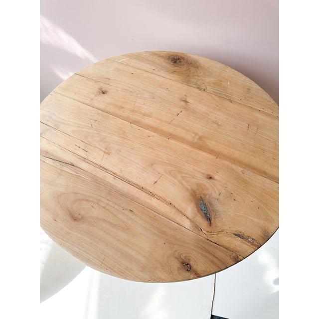 Antique Belgian wooden pedestal table dating from the late 19th to early 20th century. Featuring a circular top supported...