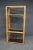 Mid Century faux bamboo rattan etagere with tinted glass shelving.