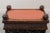 Small rectangular footstool on four solid spherical legs with an upholstered top and original springs. The walnut base...