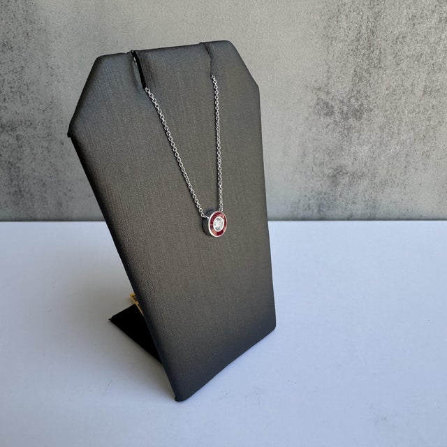Add a pop of color and sparkle to your jewelry collection with this stunning Diamond and Red Enamel Necklace in 14kt White...
