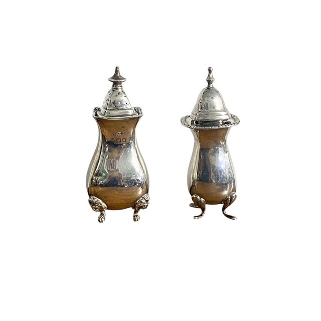 A distinguished pair of European antique condiment vessels, comprising one English Lions Paws Feet and one German example,...