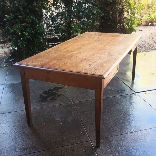 This amazing farm table is from the 19th century. It is all hand built with oak wood, and two large drawers. With a...