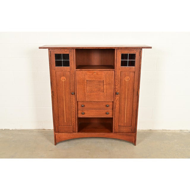An exceptional Mission or Arts & Crafts style bookcase with drop front secretary desk By L. & J.G. Stickley, "Harvey Ellis...