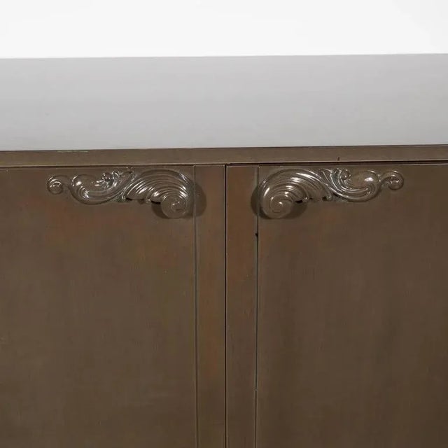 1940s Hollywood sideboard by Lorin Jackson for Grosfeld House features a grey glazed finish on bleached mahogany with...