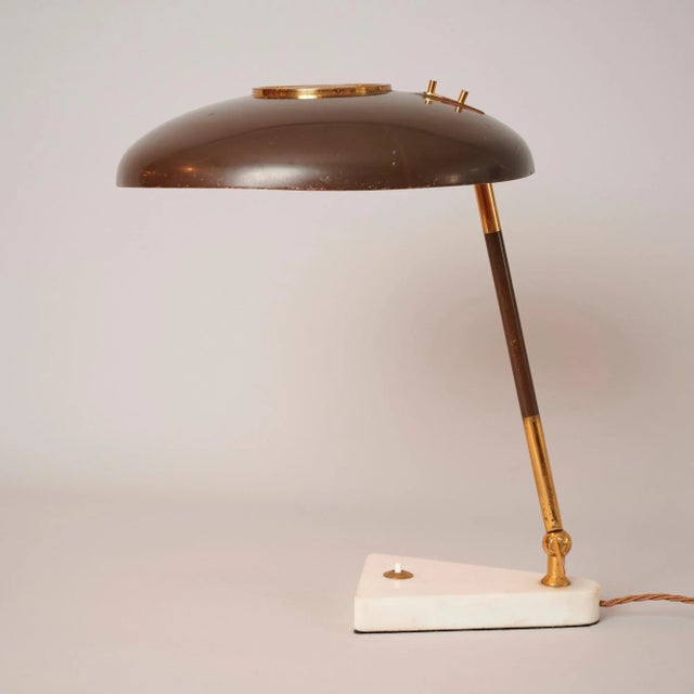Original 1950s Oscar Torlasco desk lamp with original brown paint shade. Marble base and brass elements. In good overall...