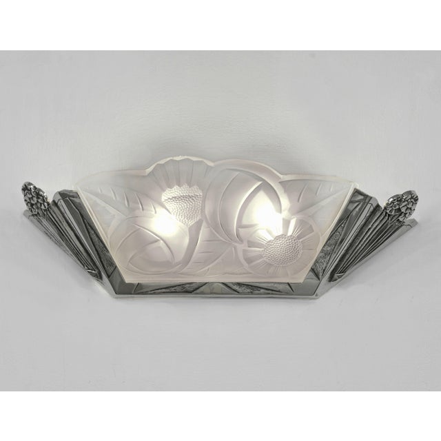 GILLES & DEGUÉ A large pair of French art deco wall sconces. Made circa 1930 in nickel plated solid brass or bronze...