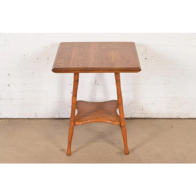 A beautiful antique Victorian carved oak parlor table or side table USA, Circa 1900 Measures: 24.25"W x 25.25"D x 29.5"H....