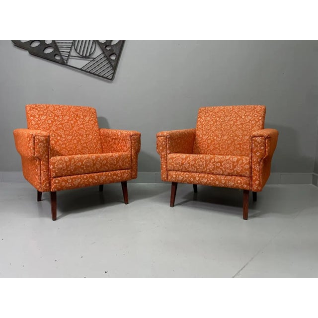 This charming pair of retro armchairs captures the warmth and character of mid-century Central European furniture design....